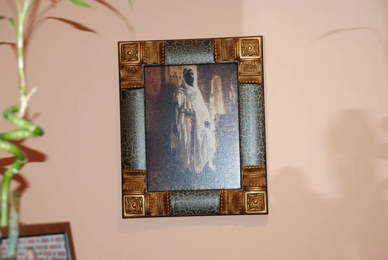 Framed historical painting displayed indoors