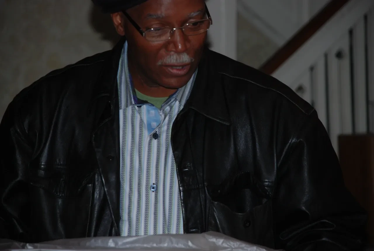 Portrait of a man in glasses and leather jacket