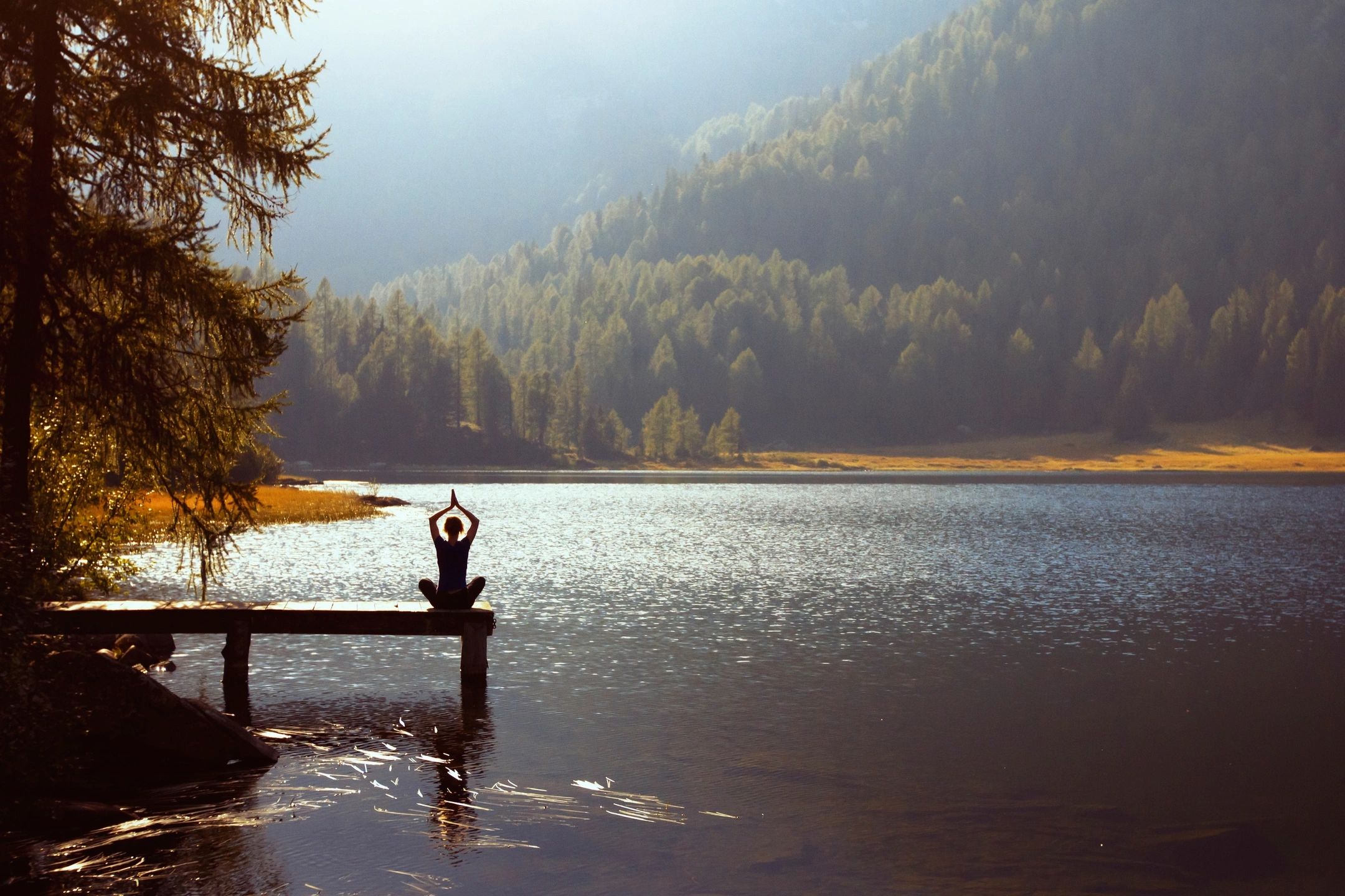 Meditation at a serene mountain lake